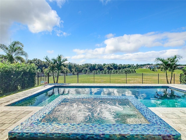 view of pool with a yard and a patio area