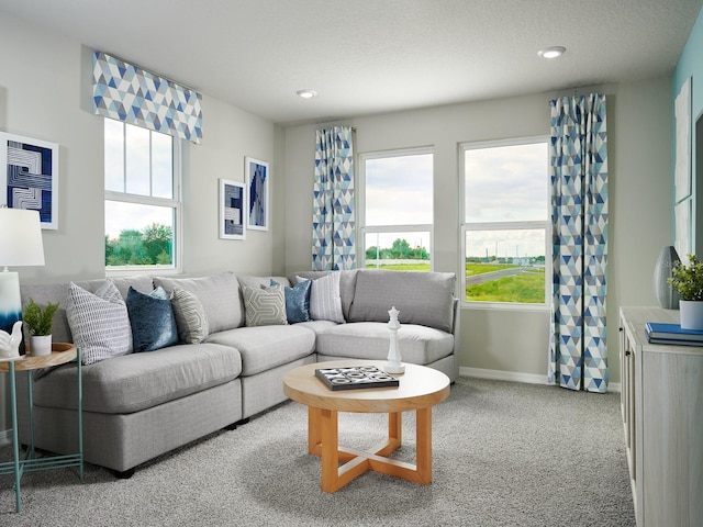 living room with light colored carpet and a textured ceiling