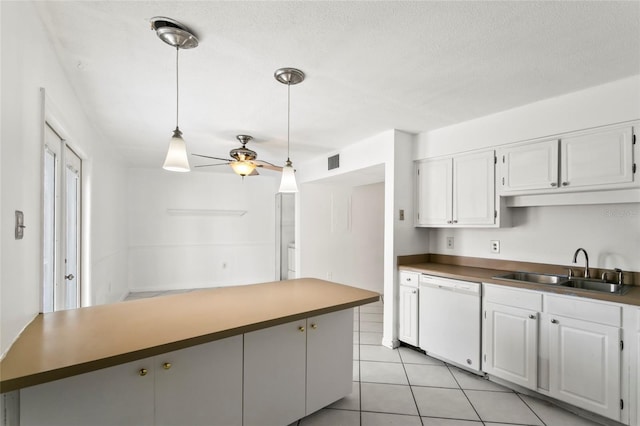 kitchen featuring dishwasher, sink, white cabinetry, light tile patterned floors, and ceiling fan