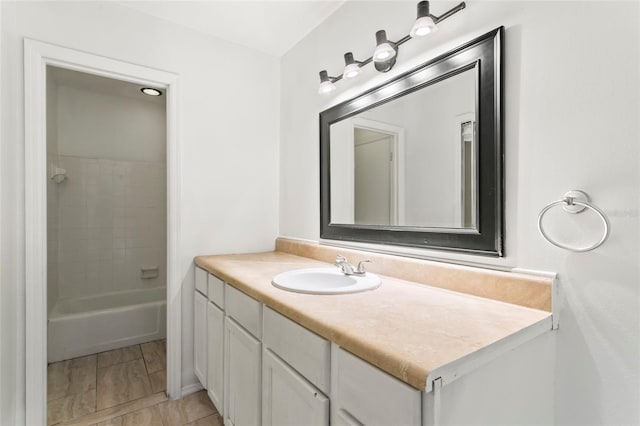 bathroom featuring vanity and shower / washtub combination