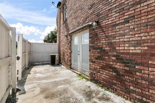 view of patio featuring cooling unit and french doors