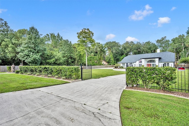 view of property's community with a lawn