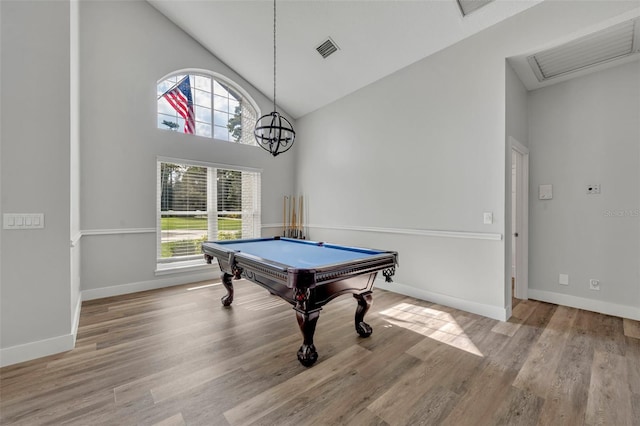 game room with light wood-type flooring, pool table, high vaulted ceiling, and a wealth of natural light