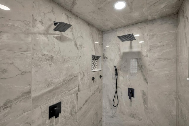 bathroom featuring a tile shower