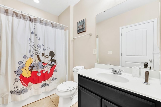 full bathroom featuring tile patterned flooring, shower / bath combo, vanity, and toilet