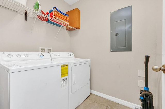 washroom with light tile patterned floors, electric panel, and independent washer and dryer