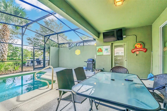 view of patio featuring a grill and a lanai