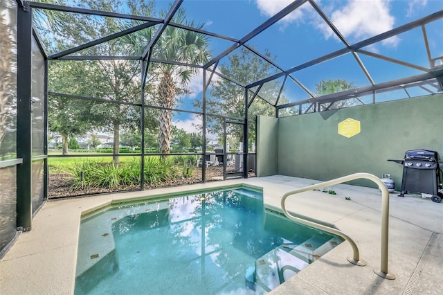 view of pool featuring a lanai, area for grilling, and a patio area