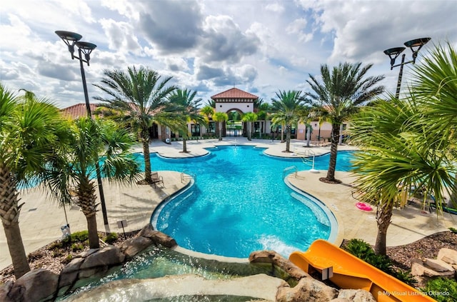 view of swimming pool featuring a patio