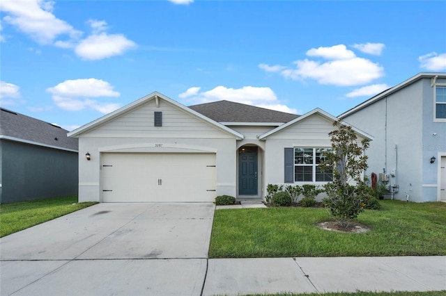 ranch-style home featuring a front yard and a garage