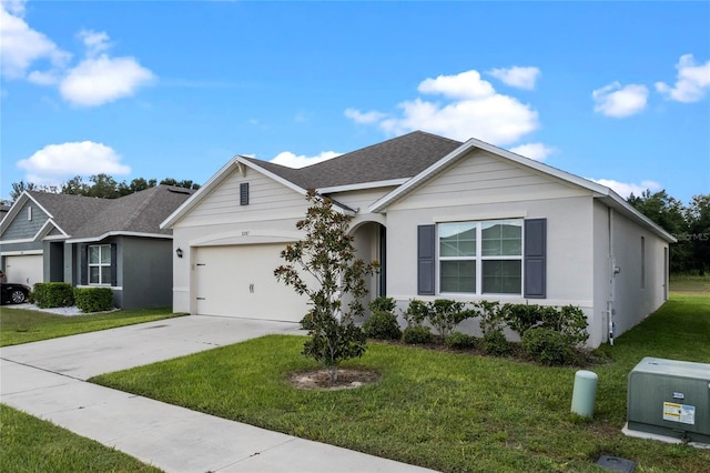 single story home featuring a front yard and a garage