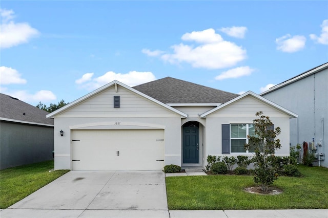 single story home with a front yard and a garage