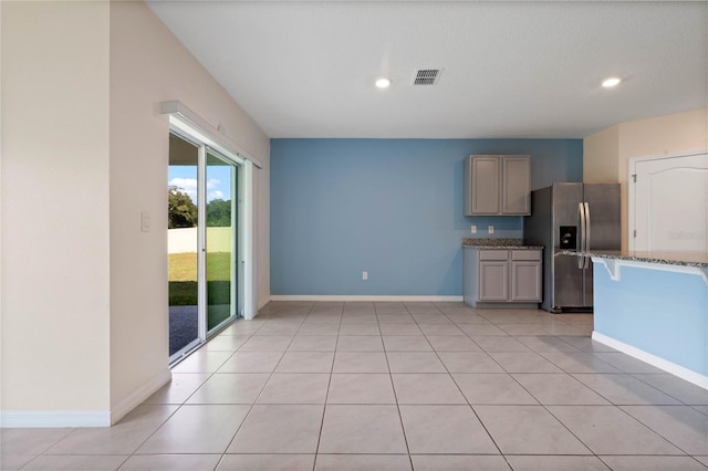 interior space with light tile patterned floors