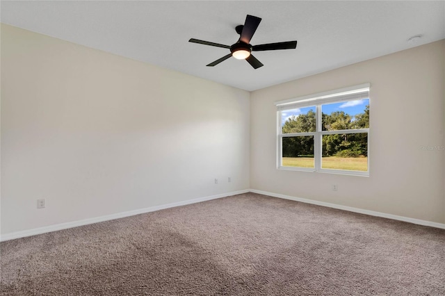 carpeted empty room with ceiling fan