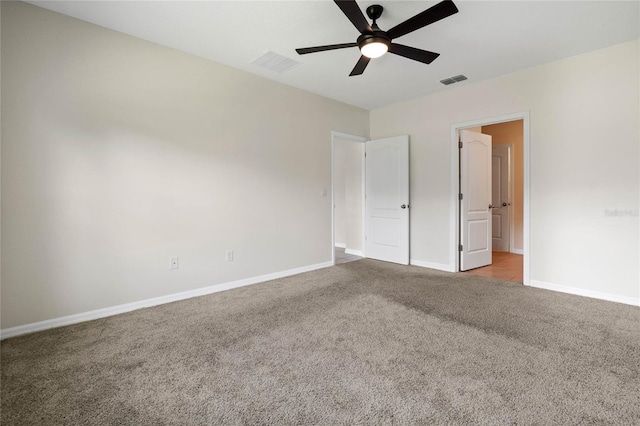 unfurnished bedroom with ceiling fan and light colored carpet