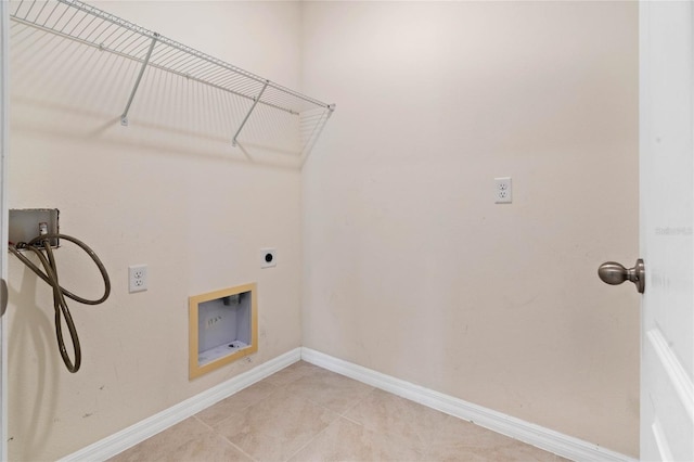 washroom with hookup for a washing machine, light tile patterned flooring, and electric dryer hookup