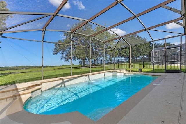 view of swimming pool featuring glass enclosure, pool water feature, and a yard