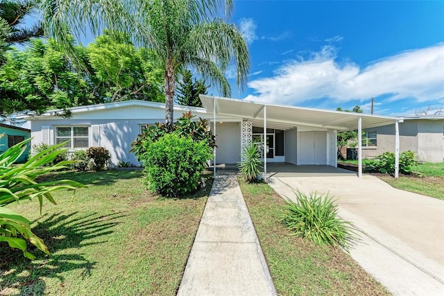 ranch-style home with a front yard and a carport