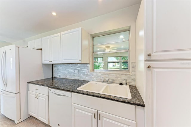 kitchen with sink, white cabinetry, decorative backsplash, and white appliances