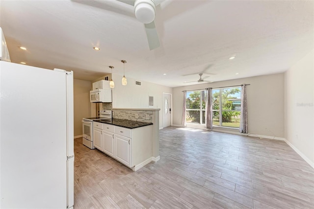 kitchen with tasteful backsplash, white cabinetry, light hardwood / wood-style flooring, pendant lighting, and white appliances