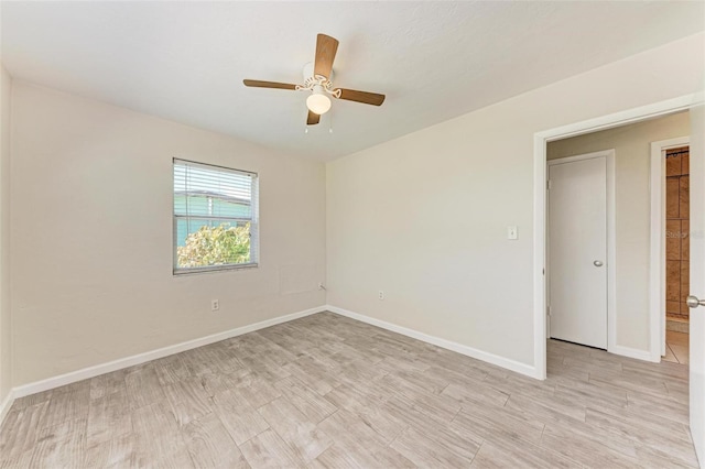 unfurnished room with light hardwood / wood-style flooring and ceiling fan