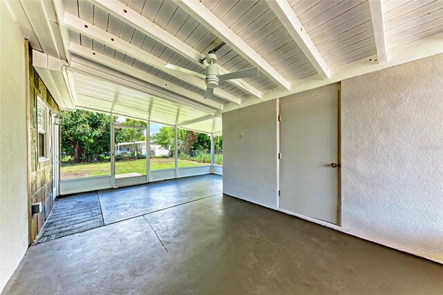 interior space featuring beamed ceiling and ceiling fan