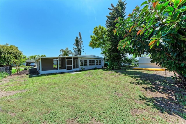 view of yard featuring a sunroom