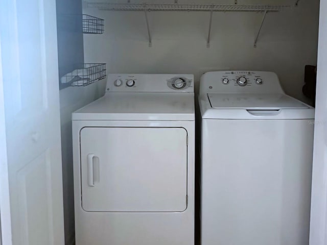 clothes washing area featuring washing machine and clothes dryer