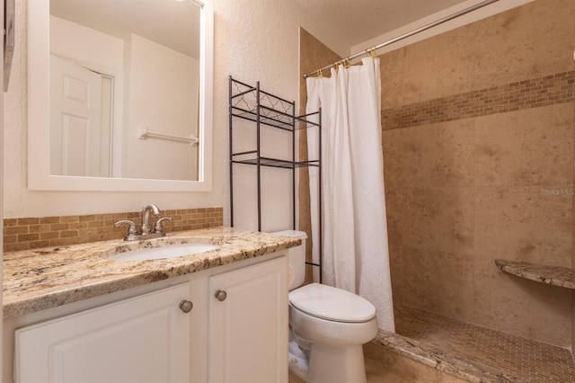 bathroom with vanity, toilet, and a shower with shower curtain