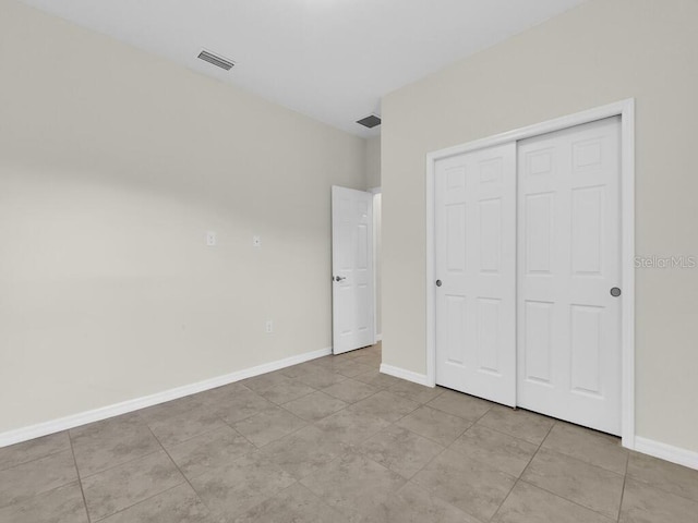 unfurnished bedroom featuring a closet