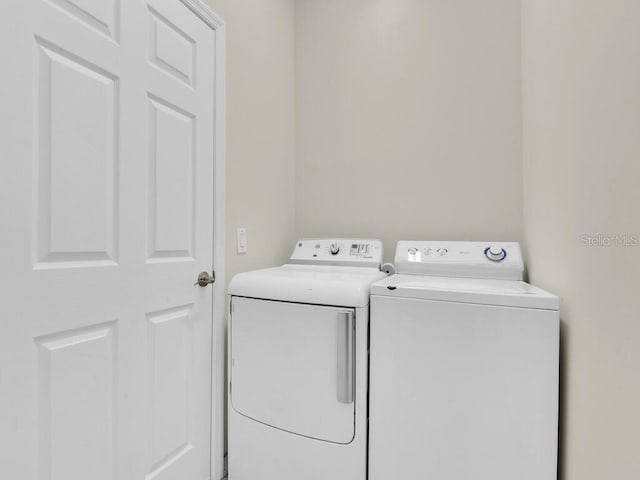 clothes washing area featuring washing machine and dryer