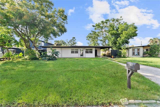 ranch-style house featuring a front lawn