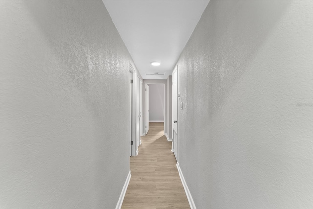 hallway featuring light hardwood / wood-style floors