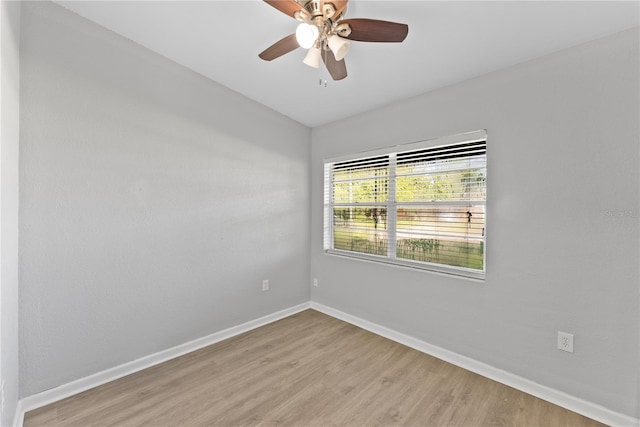 unfurnished room featuring ceiling fan and light hardwood / wood-style flooring