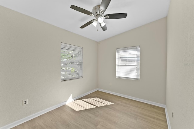 spare room with ceiling fan and light hardwood / wood-style floors