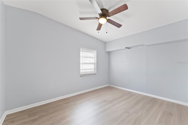 unfurnished room with light wood-type flooring, lofted ceiling, and ceiling fan