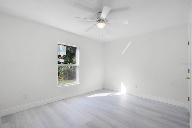 unfurnished room with ceiling fan and light hardwood / wood-style flooring