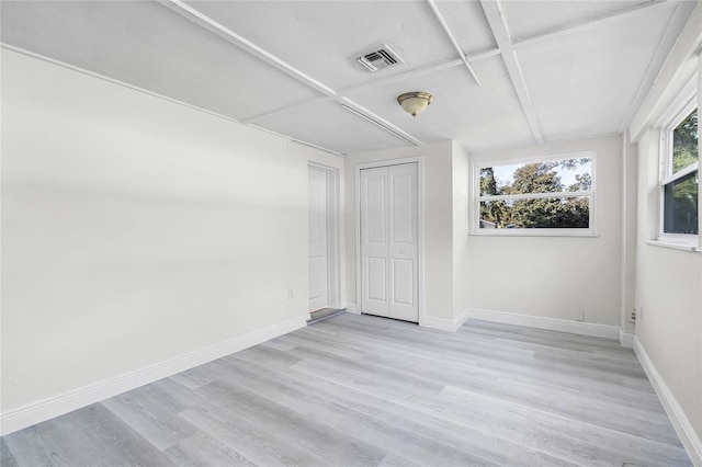 unfurnished room featuring light hardwood / wood-style flooring and coffered ceiling