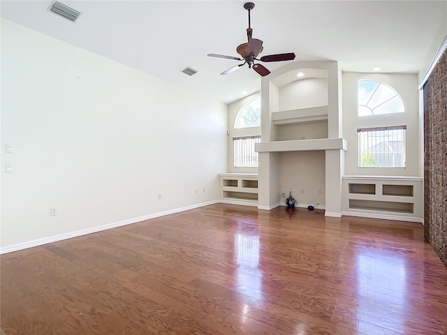 unfurnished living room featuring ceiling fan, dark hardwood / wood-style flooring, and high vaulted ceiling