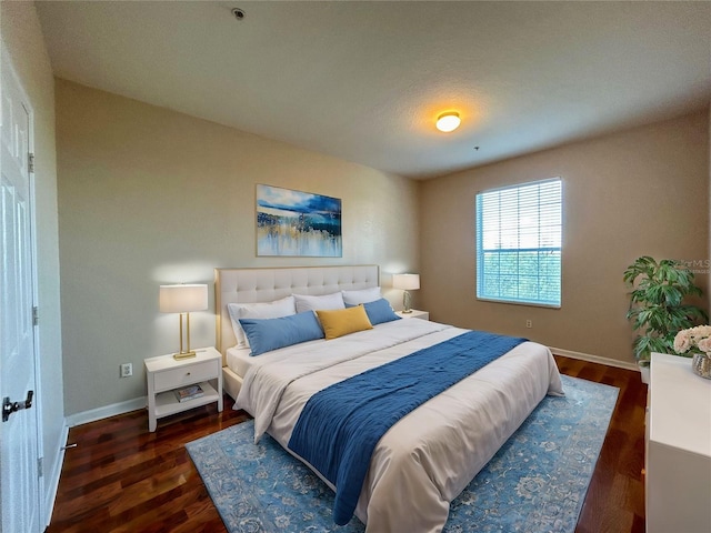 bedroom featuring dark hardwood / wood-style flooring