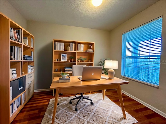 office area featuring a textured ceiling and dark hardwood / wood-style flooring