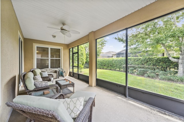 sunroom featuring ceiling fan and a wealth of natural light