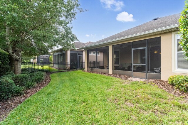 view of yard featuring a sunroom