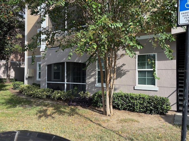 view of home's exterior featuring a lawn