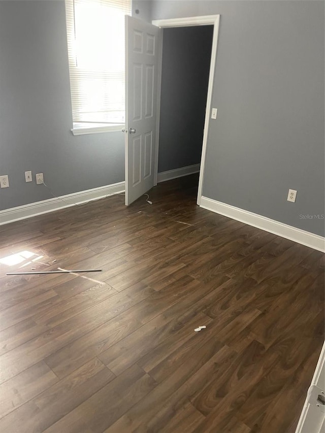 empty room featuring dark hardwood / wood-style floors