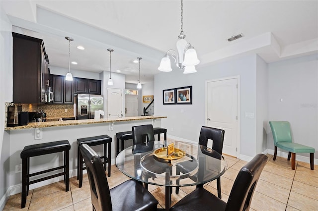 8091 Brooksville Dr, Davenport, FL 33896 - dining room with recessed lighting, light tile patterned floors, baseboards, a chandelier, and stairs