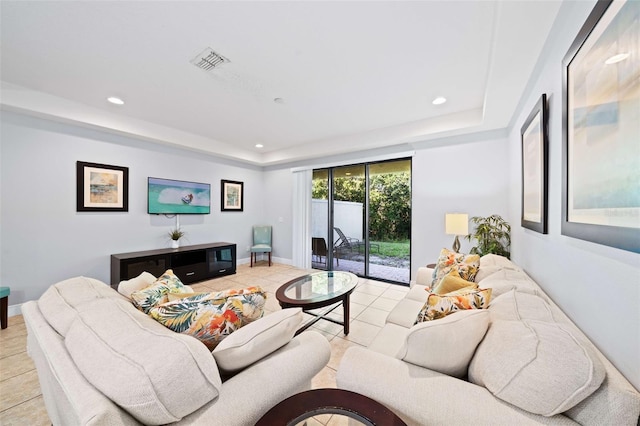 8091 Brooksville Dr, Davenport, FL 33896 - living room featuring a raised ceiling, recessed lighting, light tile patterned flooring, and baseboards