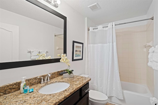 full bathroom with vanity, shower / bath combo with shower curtain, a textured ceiling, and toilet