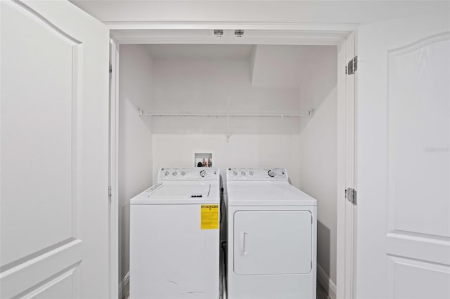 8091 Brooksville Dr, Davenport, FL 33896 - washroom featuring separate washer and dryer