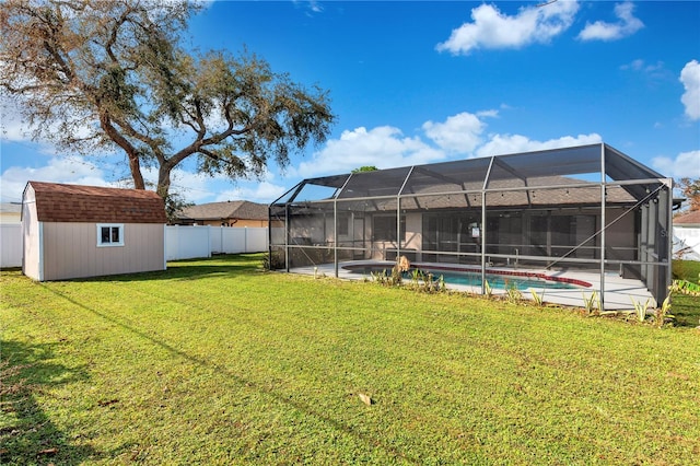 view of yard featuring a shed and glass enclosure